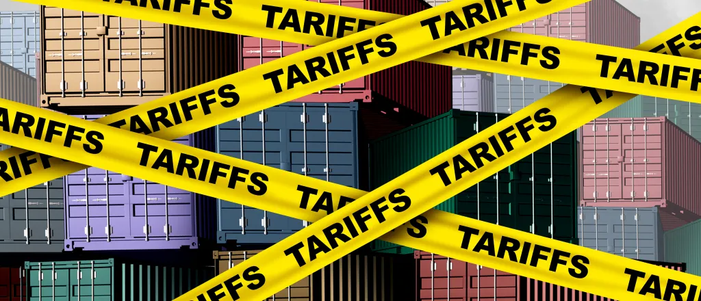 Artist's representation of cargo shipping containers with yellow banners in front labeled with the word "tariff"