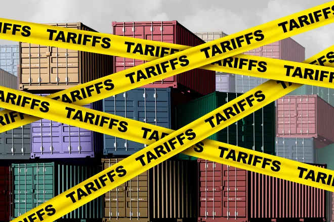 Artist's representation of cargo shipping containers with yellow banners in front labeled with the word "tariff"