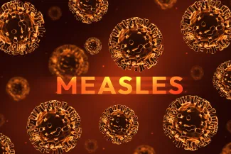 Concept artwork of viruses with the word "Measles."