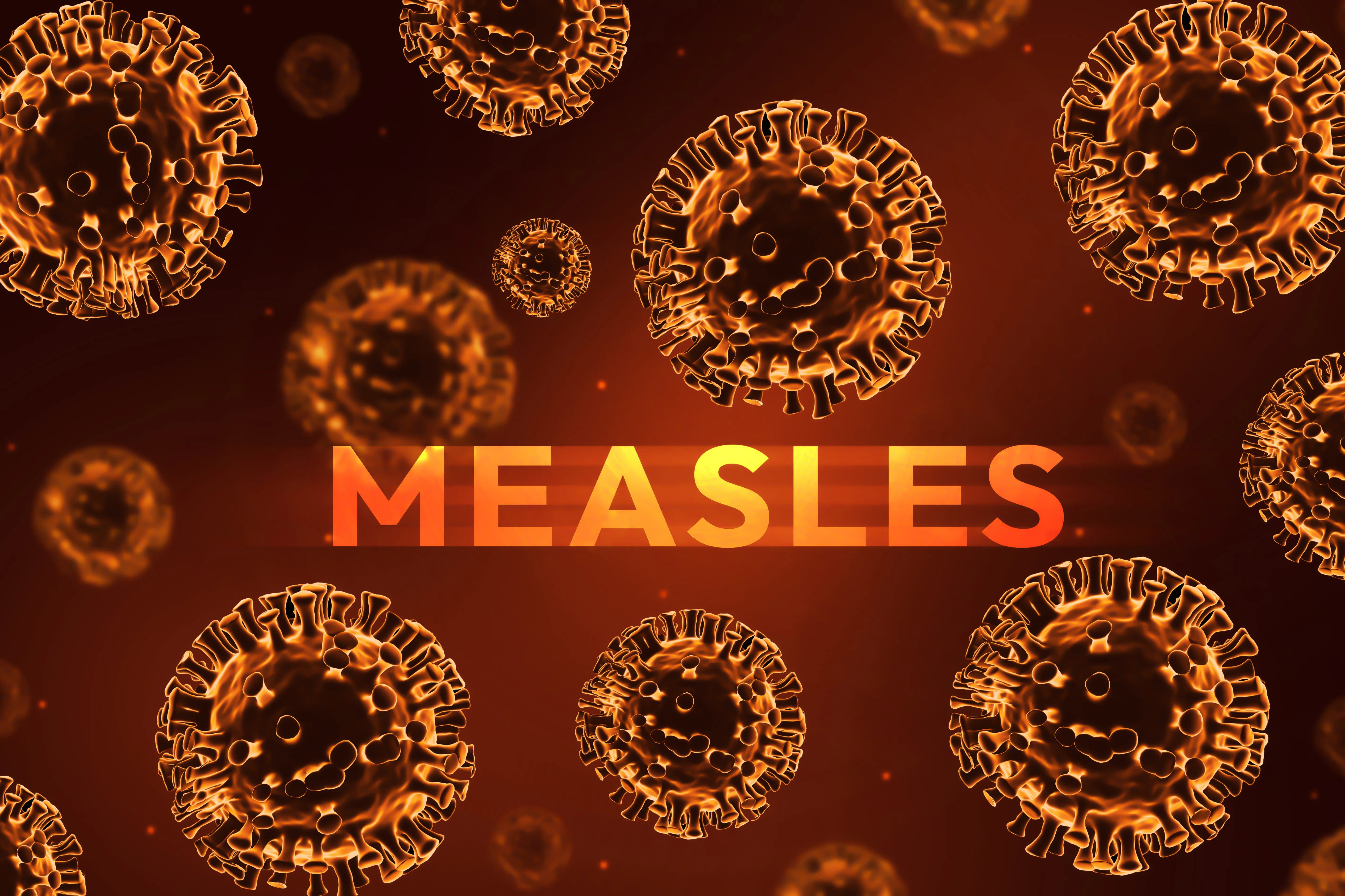 Concept artwork of viruses with the word "Measles."